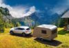 car and caravan in nature