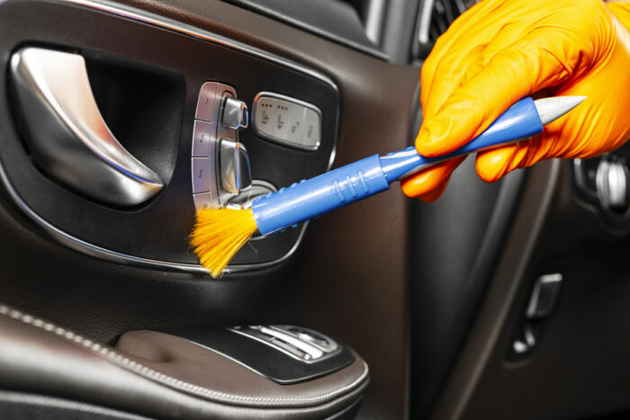 A Man Cleaning Car With Cloth And Brush. Car Detailing. Selectiv