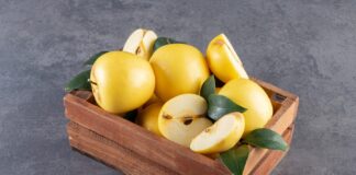 yellow apples in box